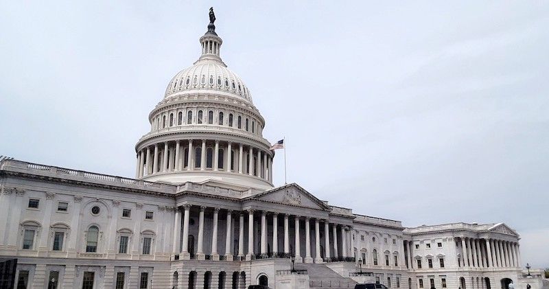 US Congress with a grey sky in the background